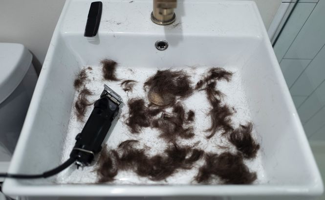 Cutting hair at home to help save money as a stay at home mom.