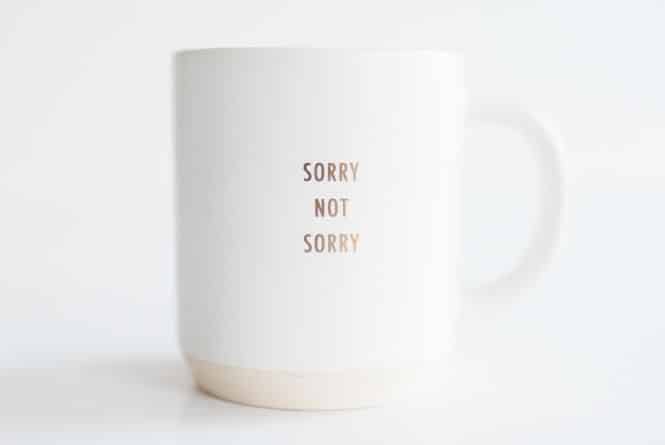 Ignore pregnancy shaming from others. This is a photo of a coffee cup that says, "SORRY NOT SORRY."